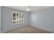 Blue bedroom featuring a ceiling fan and a window providing natural light at 4034 E Aster Dr, Phoenix, AZ 85032