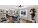 Sunlit dining area with views of the pool offers a refreshing and inviting ambiance at 4034 E Aster Dr, Phoenix, AZ 85032