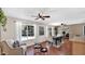 The dining room enjoys natural light from backyard windows and provides pool views at 4034 E Aster Dr, Phoenix, AZ 85032