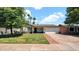 Charming single-story home featuring a well-manicured lawn and a two-car garage at 4034 E Aster Dr, Phoenix, AZ 85032