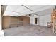 Large garage with shelving for storage and a door to the interior of the home at 4034 E Aster Dr, Phoenix, AZ 85032