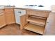 Kitchen cabinets featuring convenient pull-out drawers and a modern dishwasher at 4034 E Aster Dr, Phoenix, AZ 85032