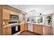 Bright kitchen with wooden cabinets, tiled countertops, and modern appliances at 4034 E Aster Dr, Phoenix, AZ 85032