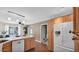 Spacious kitchen with wooden cabinets, stainless steel appliances, and hardwood floors at 4034 E Aster Dr, Phoenix, AZ 85032