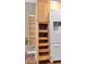 A built-in pantry with pull-out drawers and adjacent shelved pantry offer great kitchen storage at 4034 E Aster Dr, Phoenix, AZ 85032