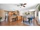 Open-concept kitchen featuring a central island, wooden cabinets, and modern appliances at 4034 E Aster Dr, Phoenix, AZ 85032