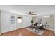 Bright living room with hardwood floors, ceiling fan, and mini-split air conditioning at 4034 E Aster Dr, Phoenix, AZ 85032