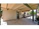 View of the covered patio area with a ceiling fan, a door to the home, and a view of the backyard pool at 4034 E Aster Dr, Phoenix, AZ 85032