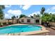 Backyard pool featuring steps, stone surround, and landscaping at 4034 E Aster Dr, Phoenix, AZ 85032