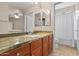 Bathroom vanity with granite countertops, cabinets, sink and a mirrored wall at 420 W First St # 217, Tempe, AZ 85281