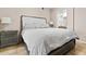 Bedroom with neutral walls and decor, an ensuite bathroom, and tile flooring at 420 W First St # 217, Tempe, AZ 85281