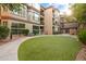 Beautiful courtyard with manicured lawn, seating, and lush landscaping, creating a serene atmosphere at 420 W First St # 217, Tempe, AZ 85281