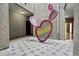 Courtyard with tiled flooring, a cactus statue, and hallways to other areas at 420 W First St # 217, Tempe, AZ 85281