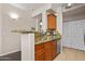 Kitchen with stainless steel appliances, granite countertops and wooden cabinets at 420 W First St # 217, Tempe, AZ 85281