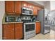 Kitchen featuring stainless steel appliances, granite countertops, and wooden cabinets at 420 W First St # 217, Tempe, AZ 85281