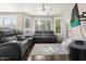 Comfortable living room with a large gray sofa set, TV, and plush chair at 420 W First St # 217, Tempe, AZ 85281