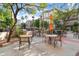 Outdoor patio area with tables, chairs, umbrellas, and views of the community at 420 W First St # 217, Tempe, AZ 85281