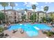 Resort-style pool with ample lounge chairs and palm trees, offering a relaxing oasis at 420 W First St # 217, Tempe, AZ 85281