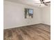 This bedroom features wood floors and a ceiling fan, offering comfort and style at 4501 E Carol Ave # 68, Mesa, AZ 85206