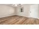 A cozy bedroom featuring wood floors and a window for natural light at 4501 E Carol Ave # 68, Mesa, AZ 85206