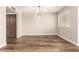 Open-concept dining room with new flooring, neutral walls, and modern lighting at 4501 E Carol Ave # 68, Mesa, AZ 85206