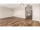 Comfortable dining room with wood floors, a view into the kitchen, and contemporary lighting at 4501 E Carol Ave # 68, Mesa, AZ 85206