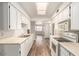 Efficient kitchen featuring white cabinetry, updated appliances, and a skylight at 4501 E Carol Ave # 68, Mesa, AZ 85206