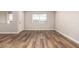 Bright and airy living room with wood flooring, white walls, and lots of natural light at 4501 E Carol Ave # 68, Mesa, AZ 85206