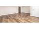 Spacious living room featuring newly installed wood floors and a fresh coat of neutral paint at 4501 E Carol Ave # 68, Mesa, AZ 85206