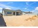 Backyard featuring a covered patio, providing space for outdoor enjoyment and future landscaping at 4619 N 179Th Dr, Goodyear, AZ 85395