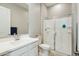 Bright bathroom with a sleek glass-enclosed shower, white vanity, and modern fixtures for a clean, updated look at 4619 N 179Th Dr, Goodyear, AZ 85395