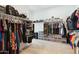 Spacious walk-in closet with clothing racks, shelves, and storage for shoes and accessories at 4619 N 179Th Dr, Goodyear, AZ 85395