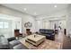 Bright living room featuring two leather sofas, and a tile floor at 4619 N 179Th Dr, Goodyear, AZ 85395
