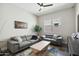 Stylish living room featuring gray sofas, a uniquely designed coffee table, and a modern aesthetic at 4619 N 179Th Dr, Goodyear, AZ 85395