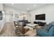 Spacious living room featuring a leather sofas, and chairs with an open concept at 4619 N 179Th Dr, Goodyear, AZ 85395