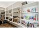 Walk-in pantry with ample shelving for organized storage at 4619 N 179Th Dr, Goodyear, AZ 85395