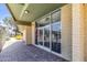 Entry with brick pavers, brick pillars, security doors, and views of the community pool at 4735 S Mill Ave, Tempe, AZ 85282