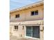 Back of the building featuring a sliding glass door, windows and brick at 4735 S Mill Ave, Tempe, AZ 85282