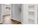This hallway area features wood-look flooring and leads to other areas of the home at 4735 S Mill Ave, Tempe, AZ 85282