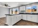 An expansive kitchen with stainless steel appliances, plenty of counter space, and wood-look flooring at 4735 S Mill Ave, Tempe, AZ 85282