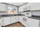 Close up view of the well-lit kitchen with stainless steel appliances and ample counter space at 4735 S Mill Ave, Tempe, AZ 85282