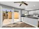 Modern kitchen with white cabinets, gray countertop, and glass sliding doors at 4735 S Mill Ave, Tempe, AZ 85282