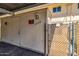 The utility shed with a parking area with a 'No Parking' sign and a gate at 4735 S Mill Ave, Tempe, AZ 85282