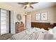Cozy bedroom featuring natural light, a dresser, and closet with open shelving at 5337 W Diana Ave, Glendale, AZ 85302