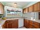 Bright kitchen featuring a large window, light countertops, and wood cabinetry, offering a functional space at 5337 W Diana Ave, Glendale, AZ 85302