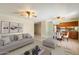 Inviting living room seamlessly flows into a dining area and kitchen, perfect for modern living at 5337 W Diana Ave, Glendale, AZ 85302