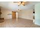 Spacious living room showcases tiled floors and offers access to various areas of the home at 5337 W Diana Ave, Glendale, AZ 85302