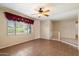 Bright living area enhanced by tile flooring, large windows, and easy access to the main entrance at 5337 W Diana Ave, Glendale, AZ 85302