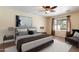 Comfortable bedroom featuring neutral tones, a large window, and contemporary decor at 5337 W Diana Ave, Glendale, AZ 85302