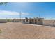 A sprawling gravel backyard, complete with a shed, offers a versatile outdoor space at 5452 E University Dr, Mesa, AZ 85205